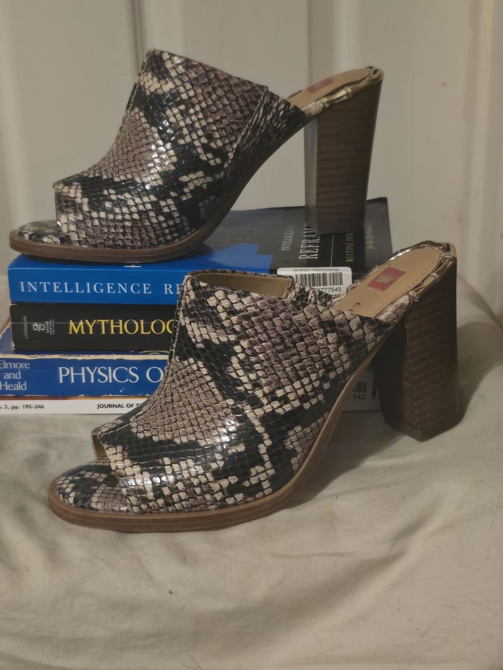 Genuine leather sole with snakeskin-print upper and gold-tone bamboo-style heel